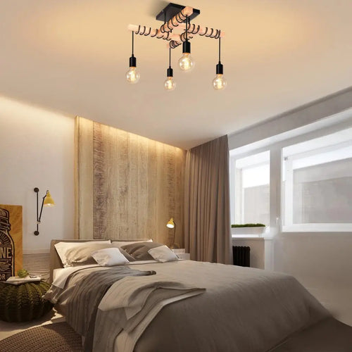plafonnier industriel vintage avec 4 têtes de lampes suspendues
