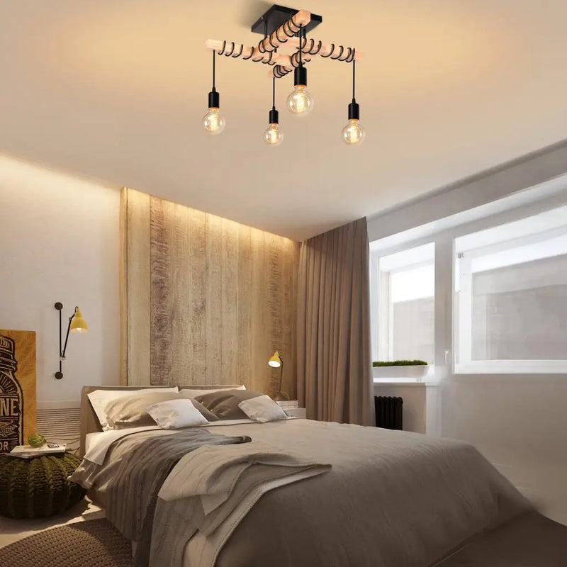 plafonnier industriel vintage avec 4 têtes de lampes suspendues
