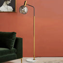 lampadaire doré et noir en métal et verre élégant
