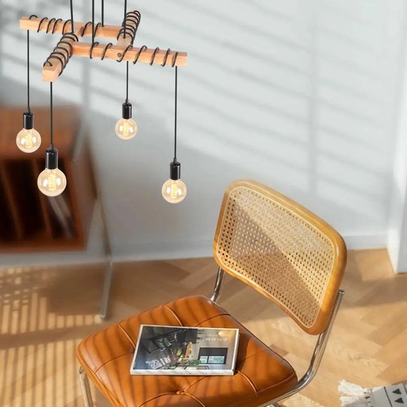 plafonnier industriel vintage avec 4 têtes de lampes suspendues