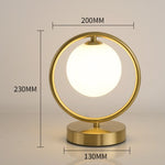 Lampe à poser design LED en métal doré Nuria