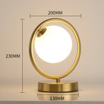 Lampe à poser design LED en métal doré Nuria