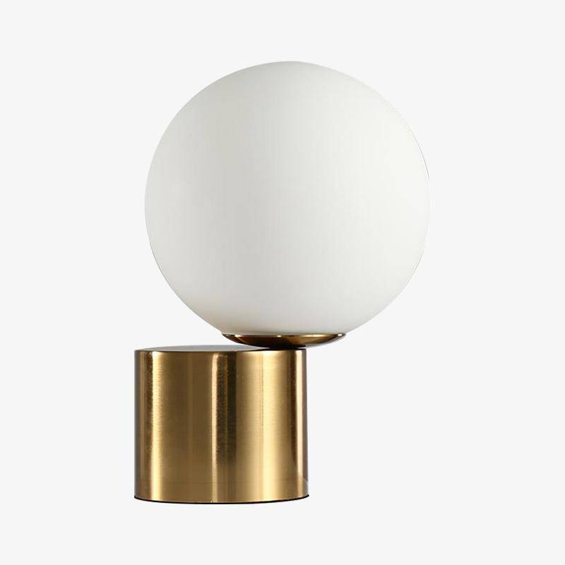 Bedside lamp with gold base and modern glass ball