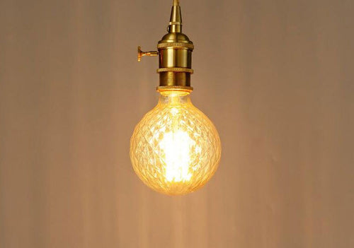 Vintage 40W Edison incandescent filament globe bulb, deformed