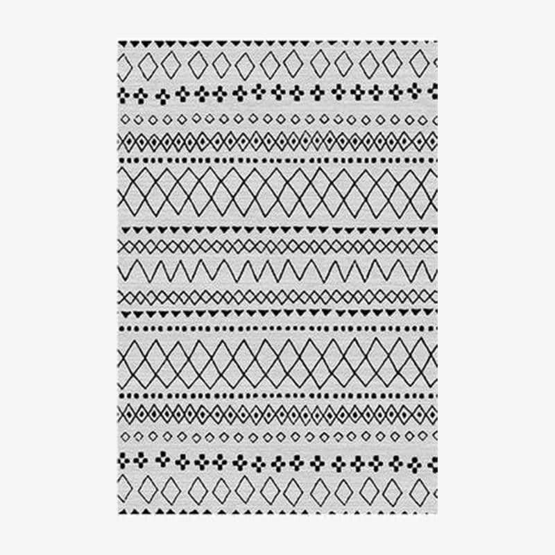 Tapis rectangle aux motifs géométriques blancs et noirs style Keecy A