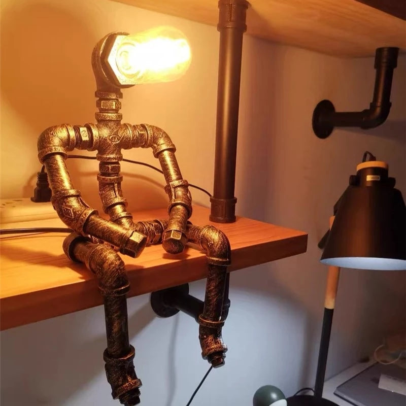 Lampe à poser industrielle LED figure robotique métallique Nile