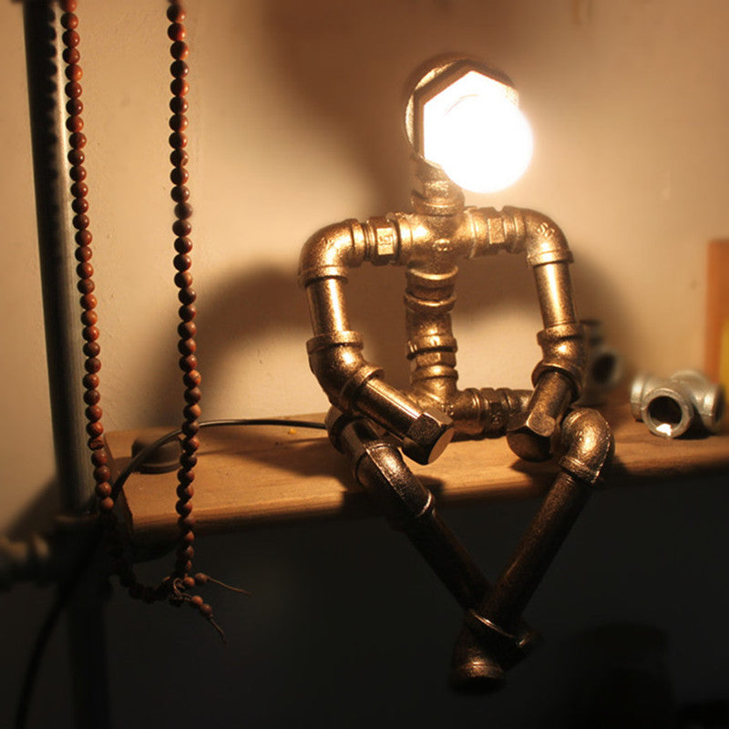 Lampe à poser industrielle LED figure robotique métallique Nile