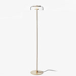 Lampadaire doré avec abat-jour en verre arrondi