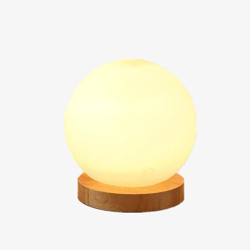Moderna lámpara de mesa LED con base de madera y bola de cristal