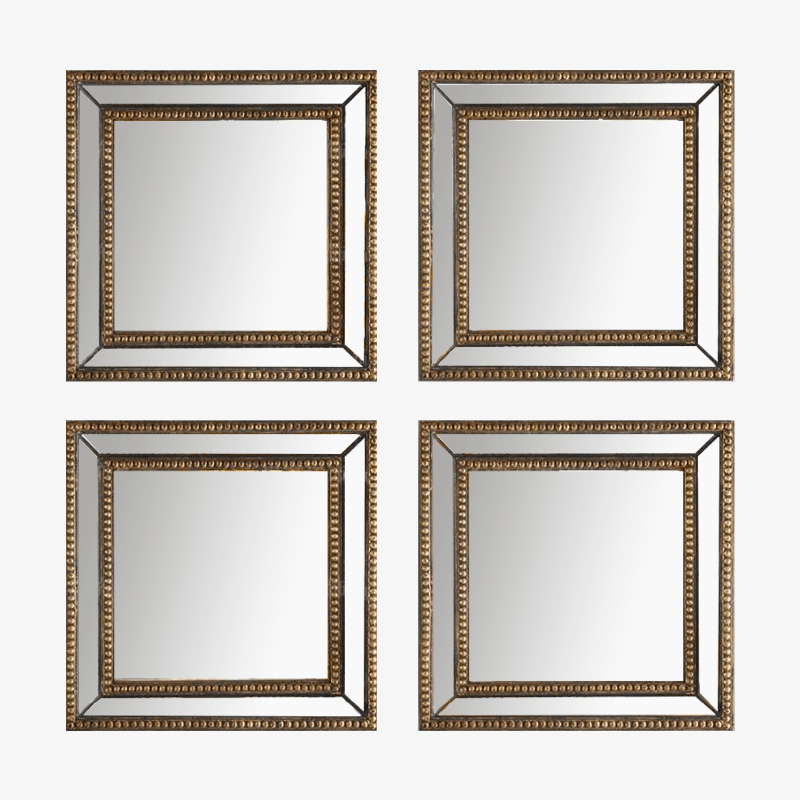 Wall mirror in gold metal