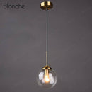 Suspension design boule en verre fumé Hang