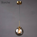 Suspension design boule en verre fumé Hang
