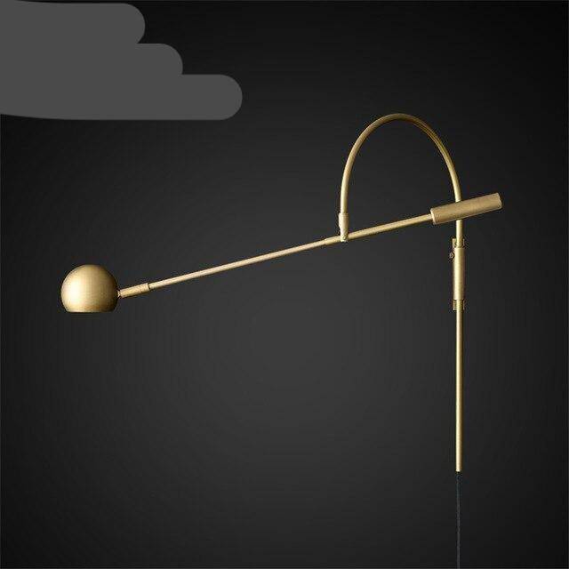 wall lamp Design LED wall lamp in gold with rounded metal shaft Shake