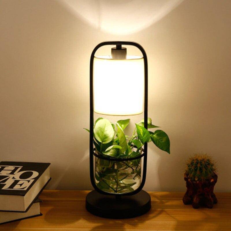 Lámpara de mesa LED con pantalla y planta