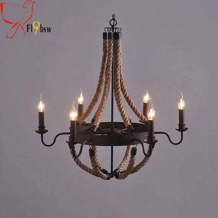 Rustic metal and rope chandelier with flame lamps