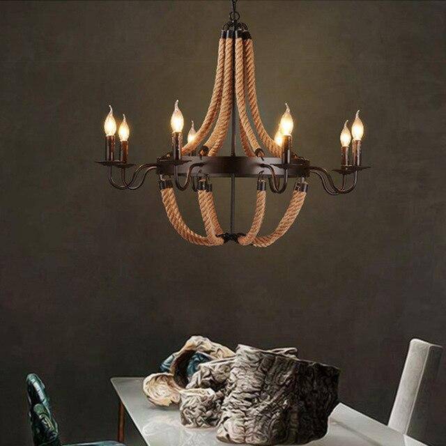 Rustic metal and rope chandelier with flame lamps