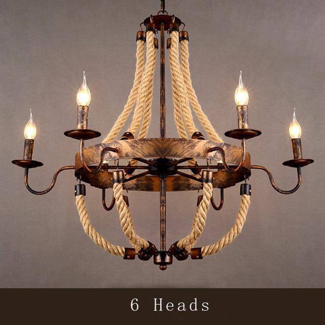 Rustic metal and rope chandelier with flame lamps