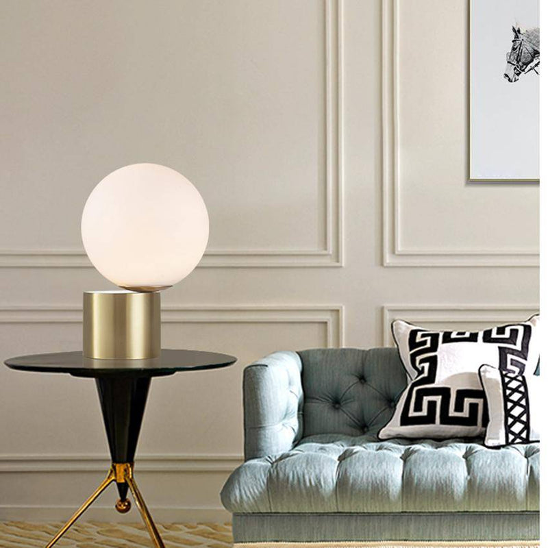 Lampe de chevet à base doré et boule en verre Moderne