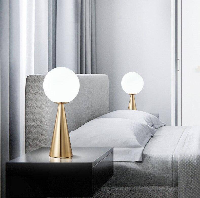 Design bedside lamp with golden cone and ball lamp