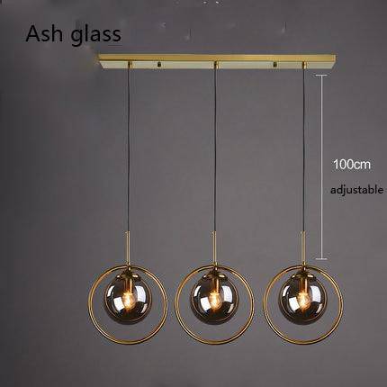 Suspension dorée à LED design boule en verre fumé