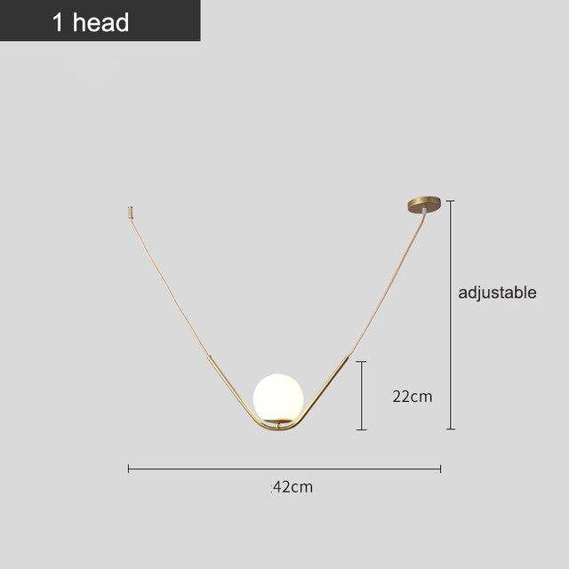 Suspension design boule de verre avec bras doré Arto