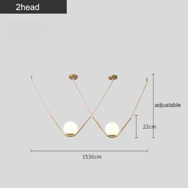 Suspension design boule de verre avec bras doré Arto