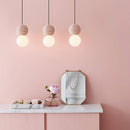 Suspension design en boule en ciment façon terrazzo LED