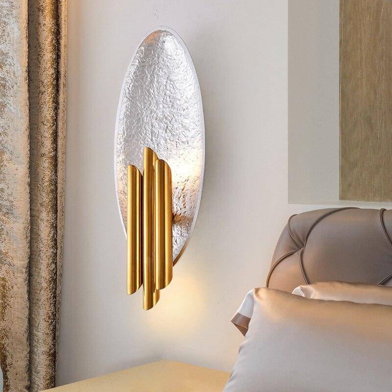 Lámpara de pared design concha ovalada y lámparas cilíndricas doradas Concha