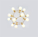 Lustre design géométrique avec plusieurs bras dorés et boules Molecule