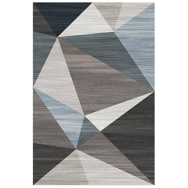 Geometric design carpet with grey rectangle and blue touches Area
