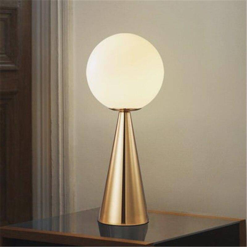 Design bedside lamp with golden cone and ball lamp