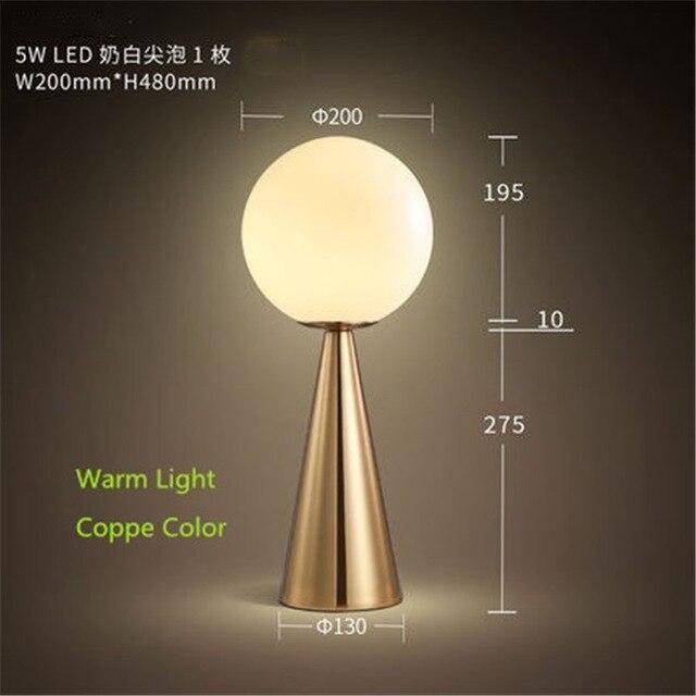 Design bedside lamp with golden cone and ball lamp