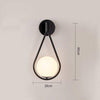 Applique murale design LED doré avec boule blanche Sconce