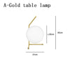 Lampe de chevet design dorée avec boule en verre Lampen