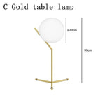 Lampe de chevet design dorée avec boule en verre Lampen