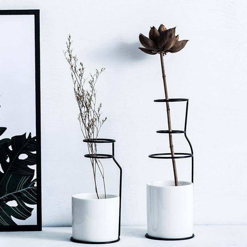 Scandinavian ceramic design vase with metal sticks