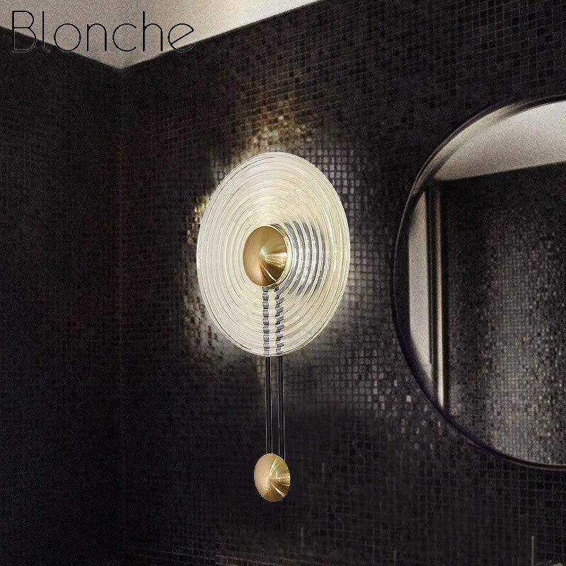 Lámpara de pared design LED con círculo dorado y disco de vidrio Sconce