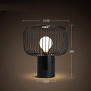 Lampe à poser design à LED avec abat-jour cage arrondie en métal noir