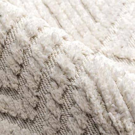 Rectangular white Berber carpet with raised check pattern and fringes