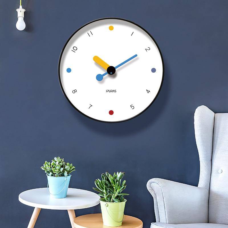 Round wall clock with playful coloured circles Rato