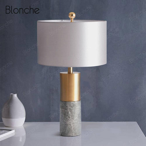 Lampe à poser design LED en forme cylindrique dorée et en marbre