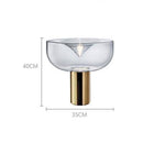 Lampe à poser design LED avec abat-jour arrondi et cylindre doré
