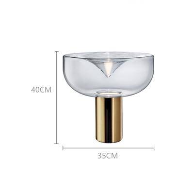 Lampe à poser design LED avec abat-jour arrondi et cylindre doré