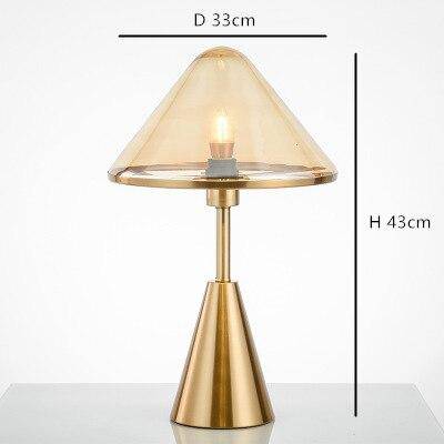 LED design table lamp with conical base in gold metal