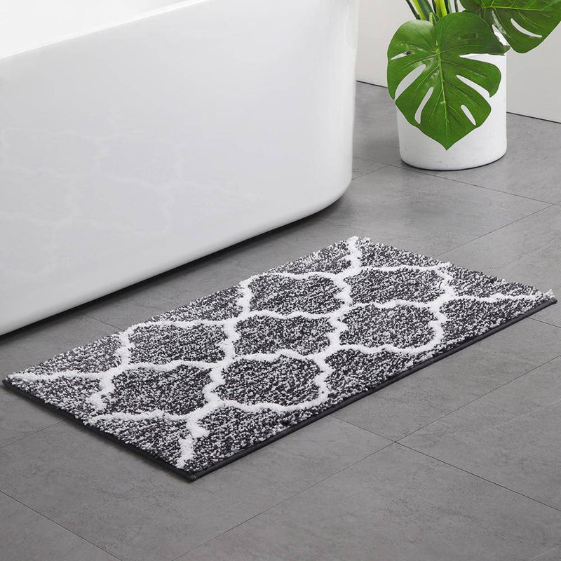 Rectangular coloured microfibre bath mat with Moro pattern