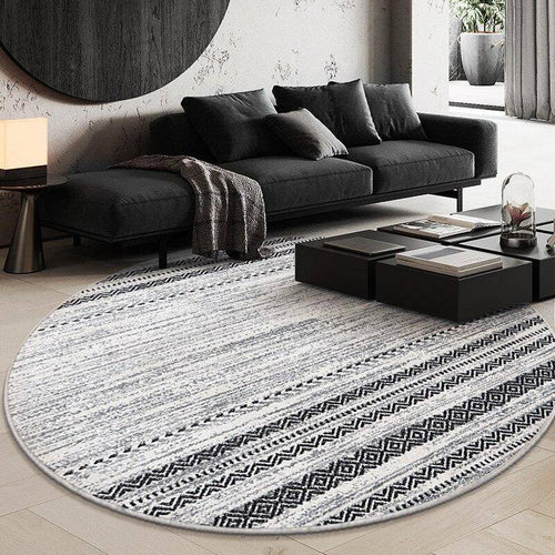 Round black and grey rug with geometric pattern Nordic