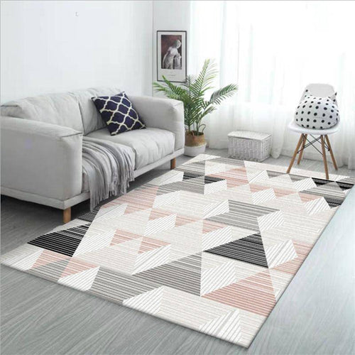 Modern carpet with pink and white geometrical shapes