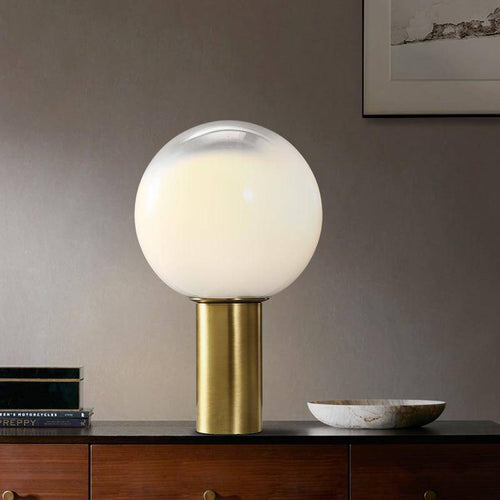 Lampe à poser design LED de forme cylindrique dorée et boule en verre blanc