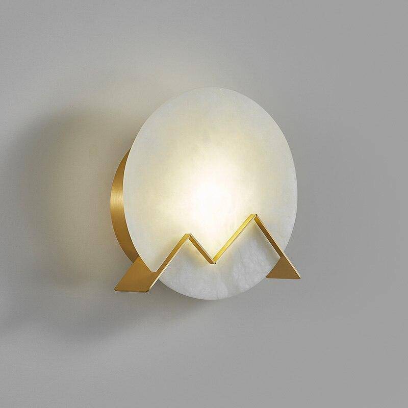 Lámpara de pared design LED con círculo de mármol y metal dorado