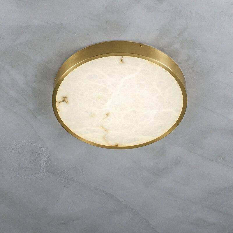 Plafonnier design LED rond en marbre avec bords dorés